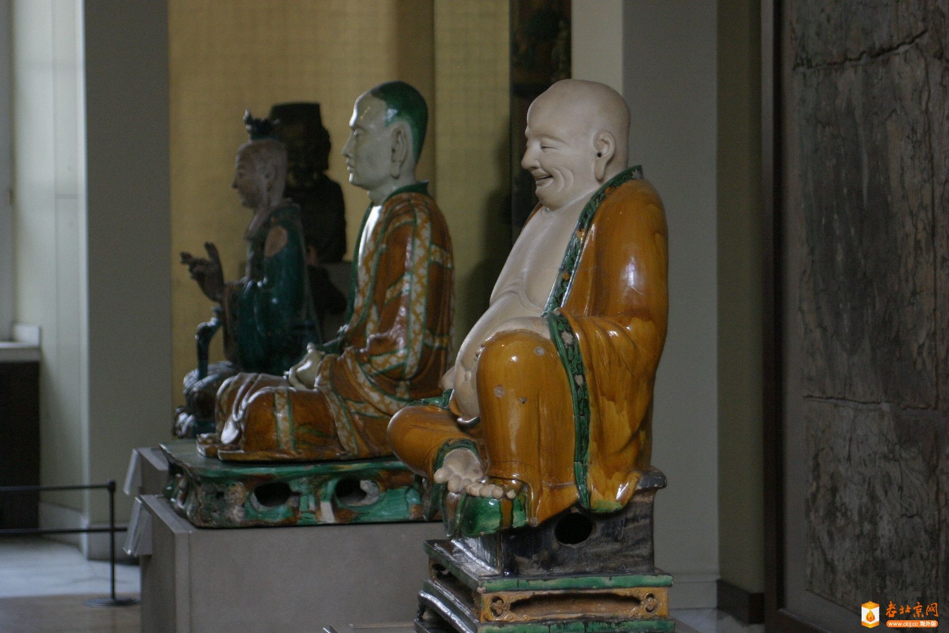 10.Բstoneware figure of budai under green and ochre glazes[].JPG