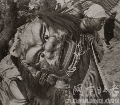 A man holding a Lion Mask at the Shrine of Miao Feng Shan